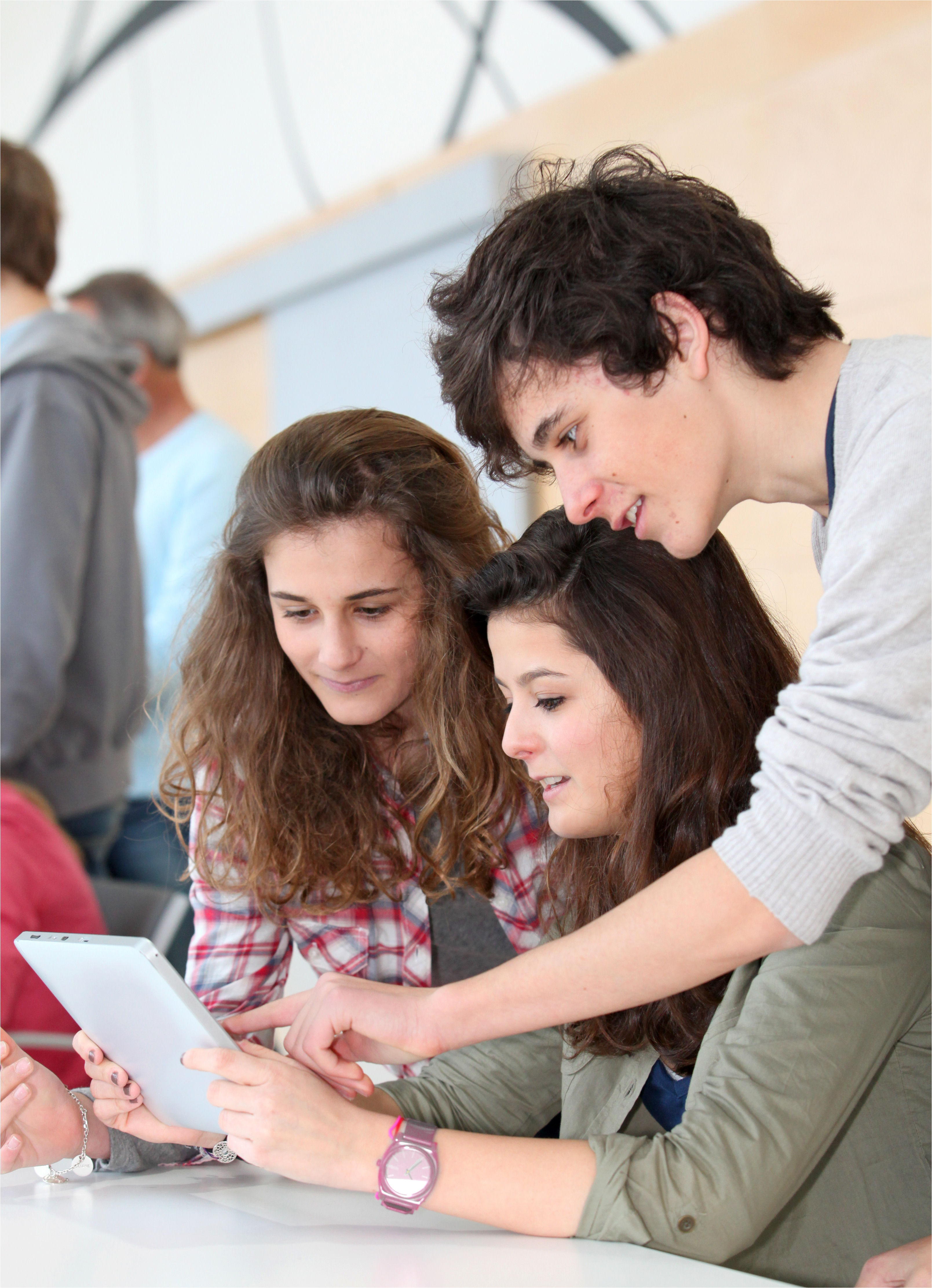 students viewing a webpage on a tablet